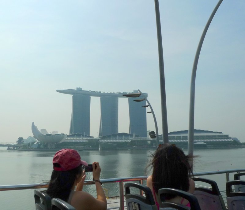 Bloggers taking photos of Marina Bay Sands from the FunVee Top Deck Bus