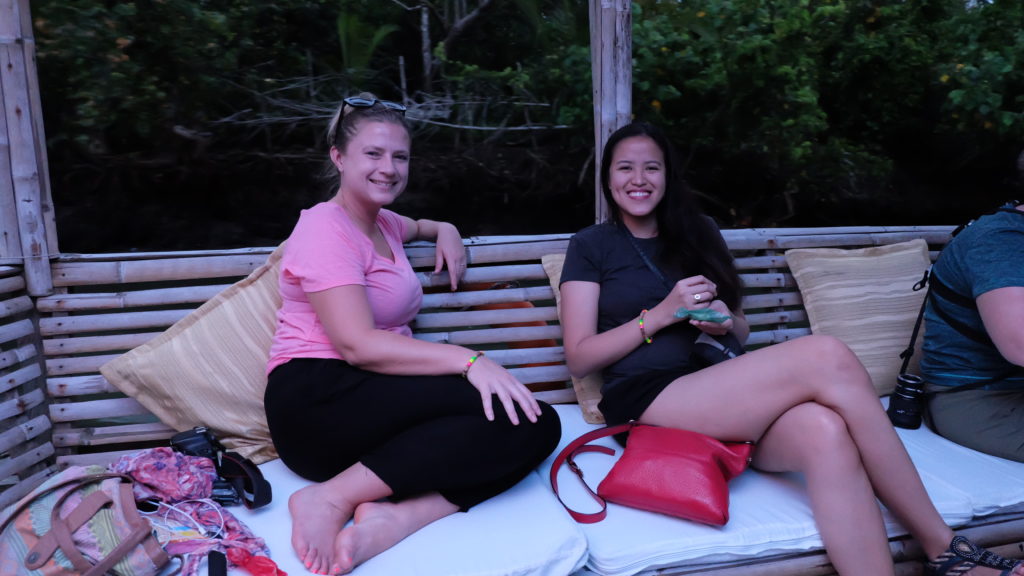 Sarah and I sitting comfortably during the Buhatan River Cruise activity. | Photo by Yogo and Cream
