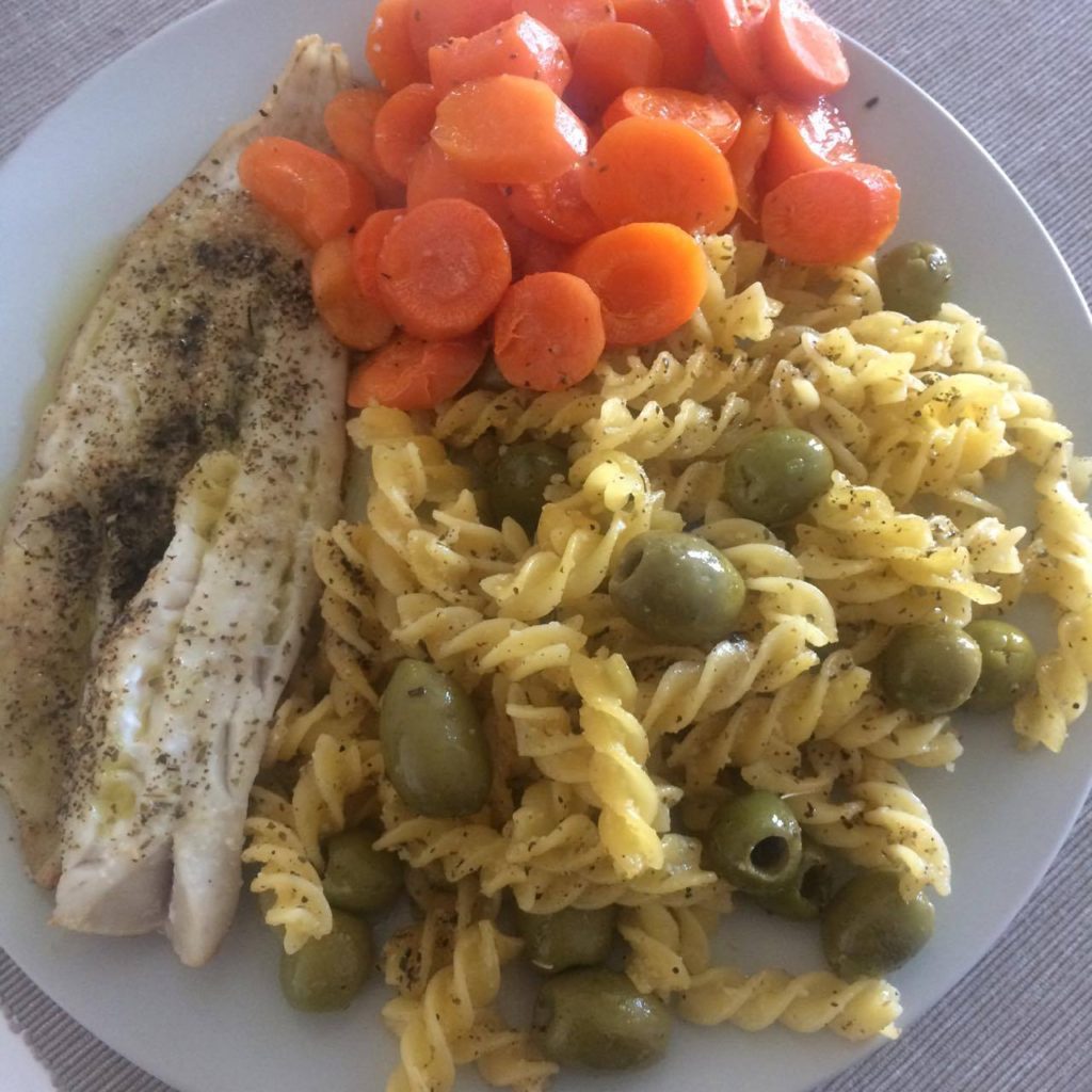 Trying to cook Italian style. Baked fish and carrots. Pasta with olives. But of course you don't all put them in a single plate! 